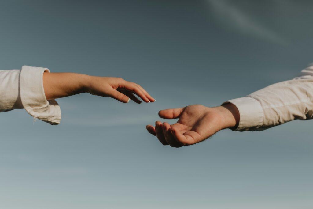 a person offering their hand to another